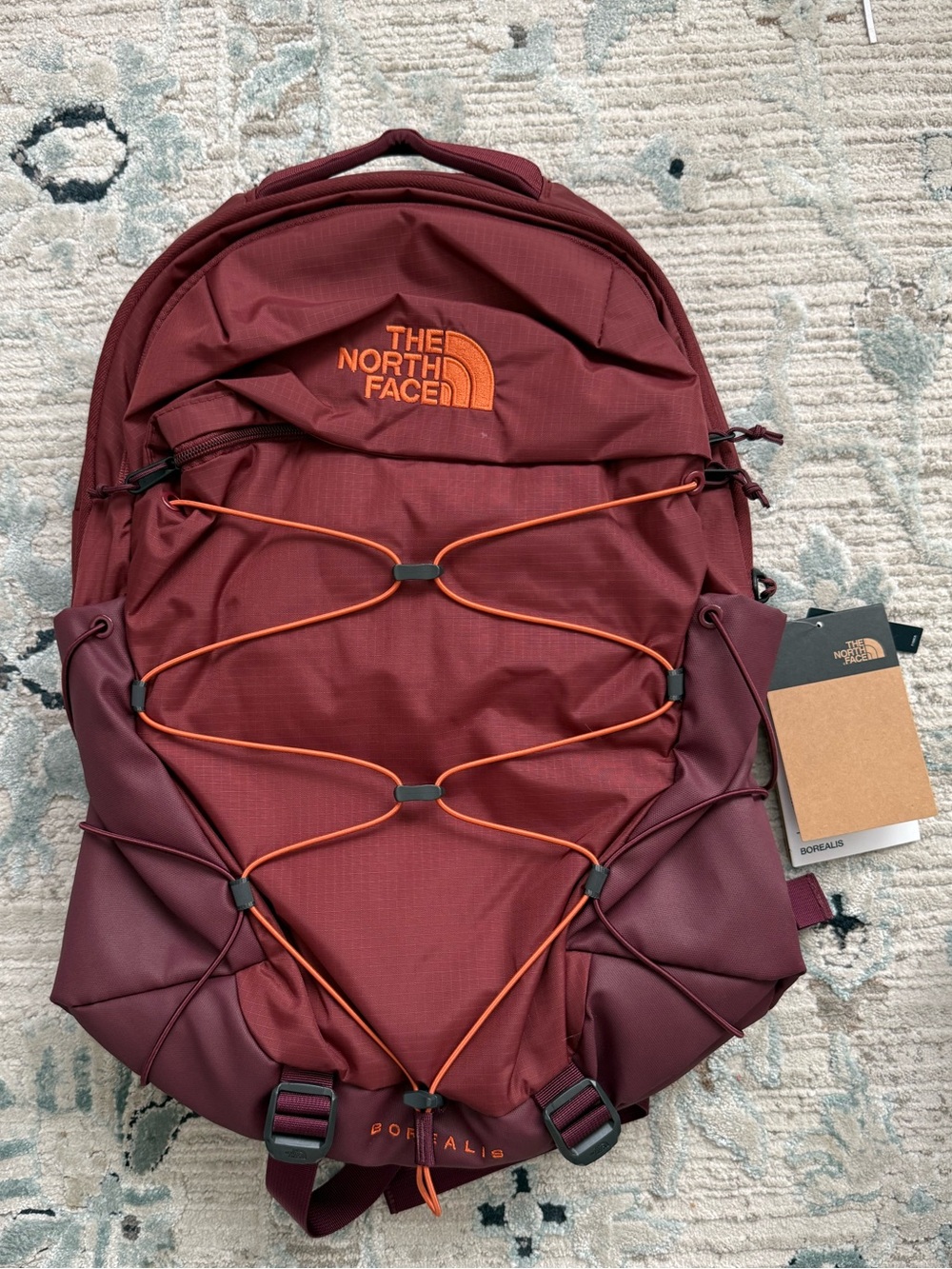 The North Face Borealis Burgundy Backpack with Orange Bungee Accents